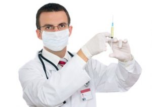 doctor holding a needle