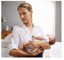 mother holding baby prior to vaccinations