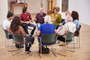 group discussing chronic illness